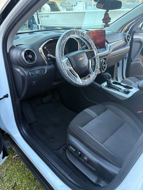 The same Chevy Blazer interior after detailing — carpet shampooed, leather cleaned, console and vents clear