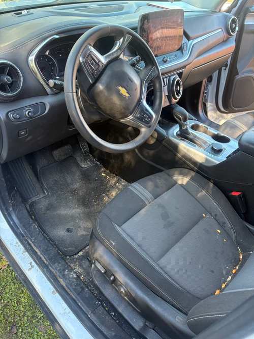 Chevy Blazer interior before detailing — sand and debris ground into the carpet and floor mats