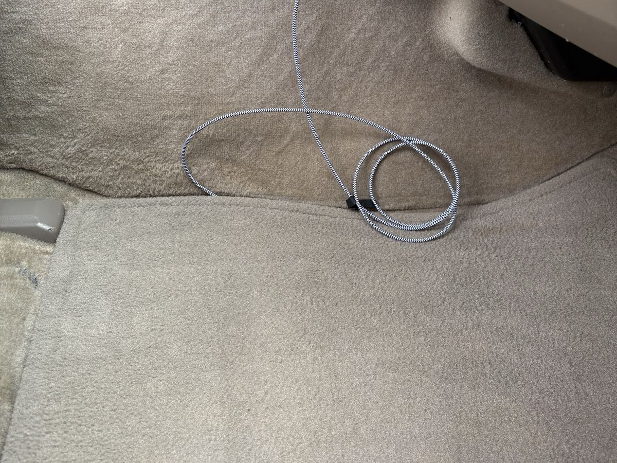 The same tan carpet after shampooing and extraction — stain gone, pile brushed even