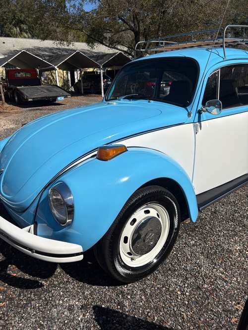 Classic blue and white Volkswagen Beetle detailed inside and out
